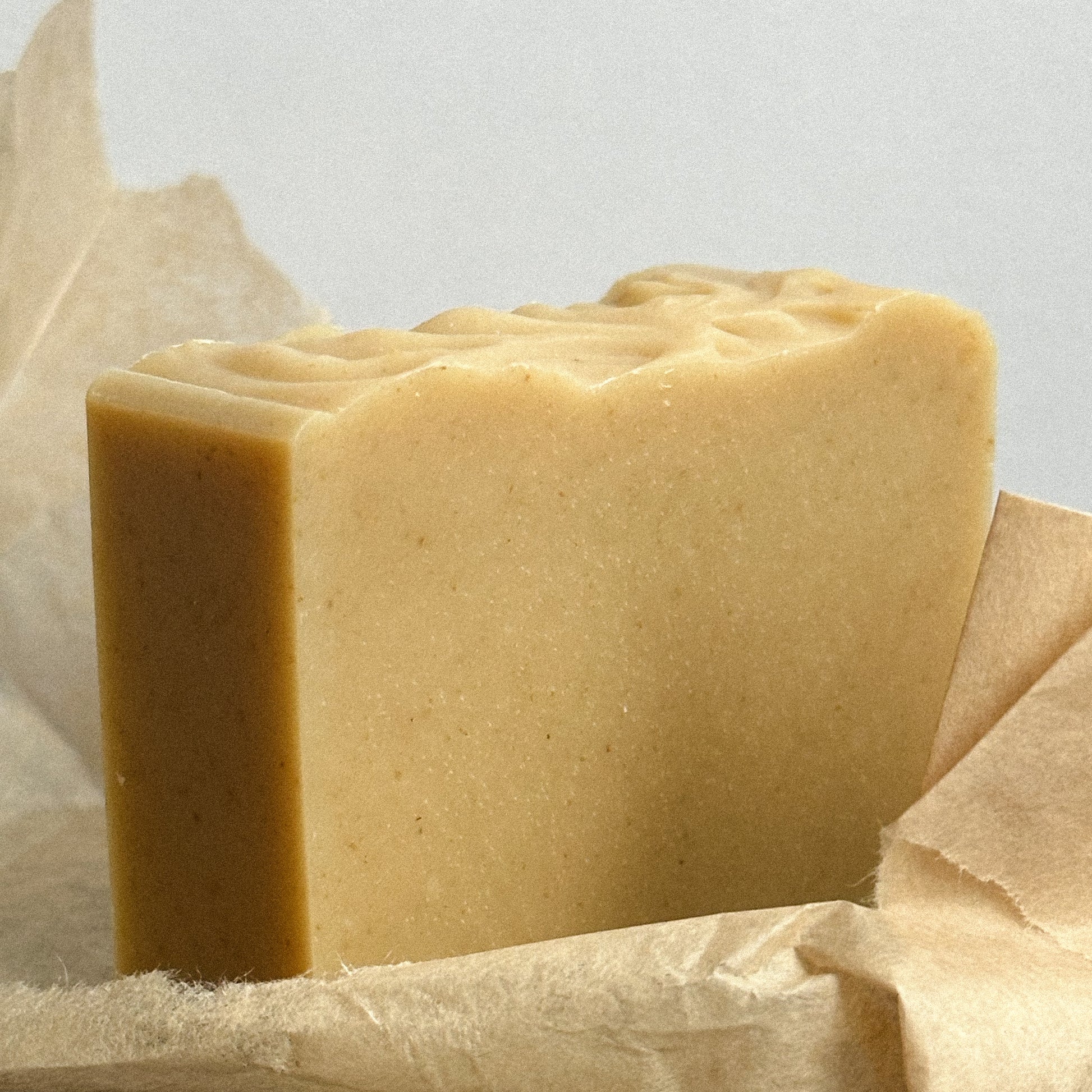 A rectangular bar of Nuska Tonka Bean and Oat natural soap whitout package.