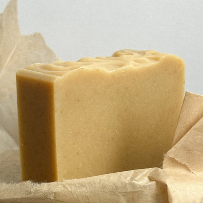 A rectangular bar of Nuska Tonka Bean and Oat natural soap whitout package.