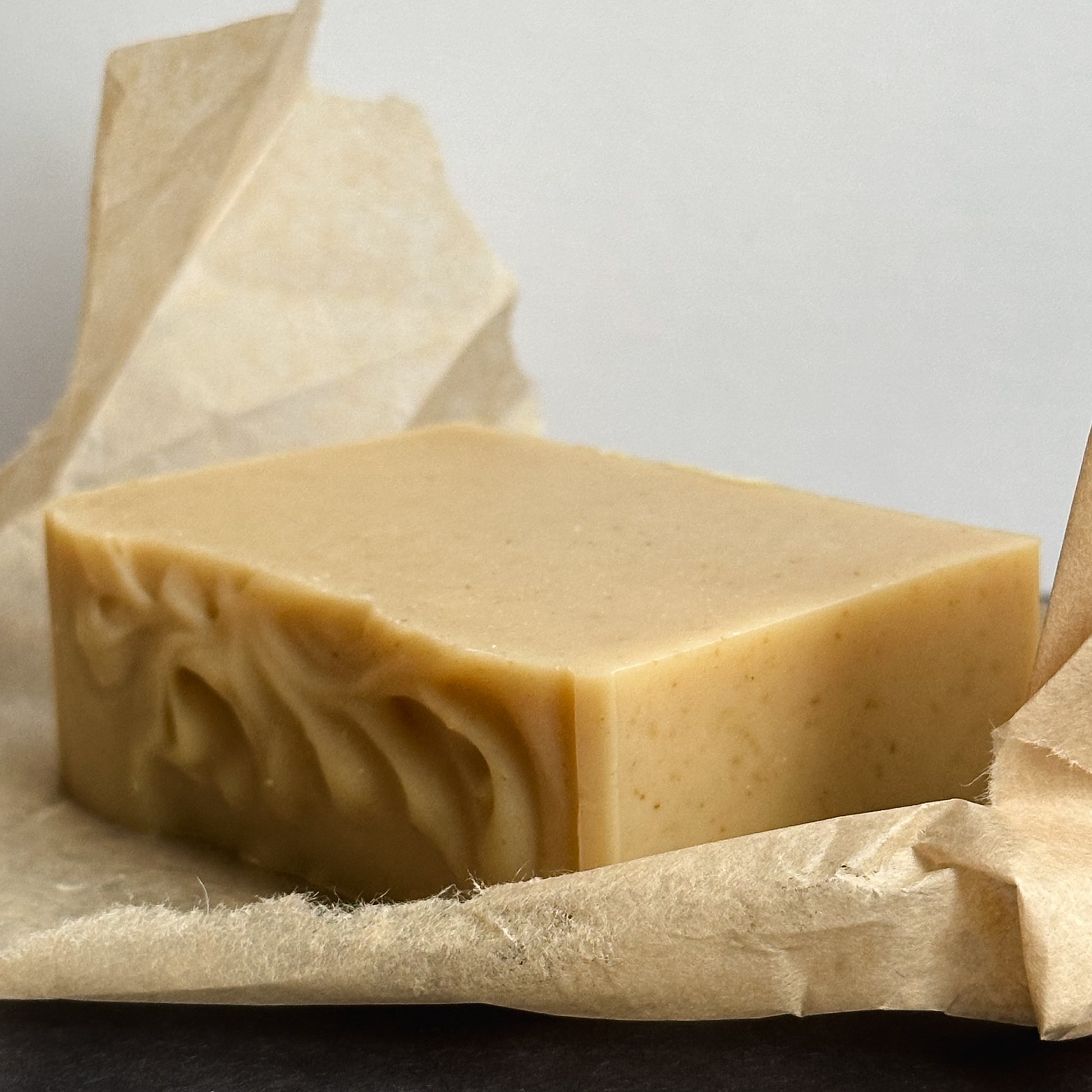 A rectangular bar of Nuska Tonka Bean and Oat natural soap whitout package - side view.