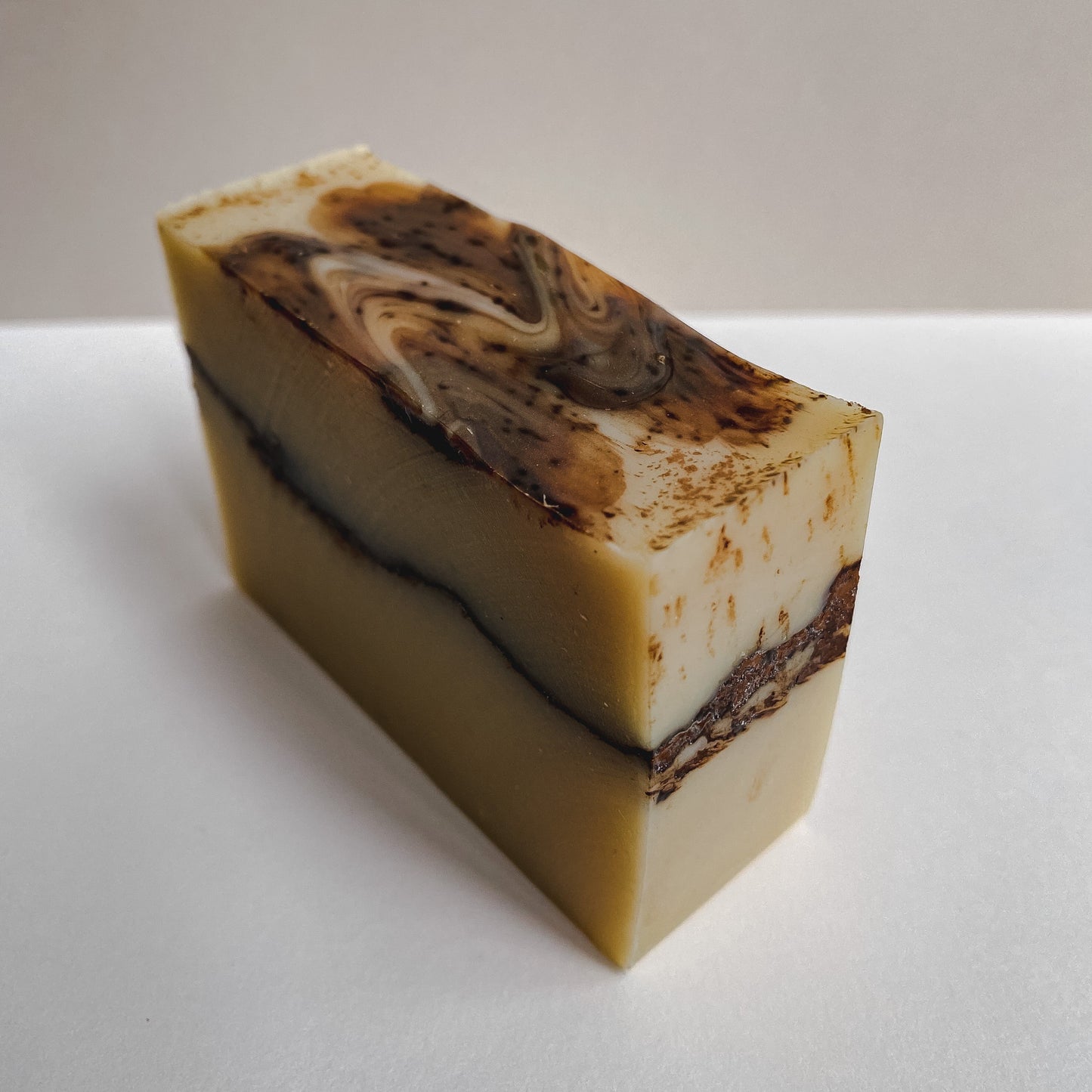 A rectangular bar of Nuska coconut milk soap, packaging-free.