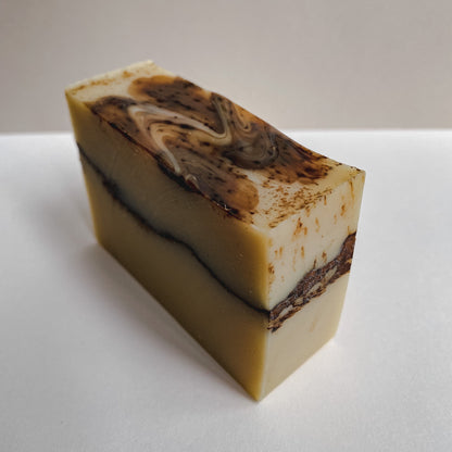 A rectangular bar of Nuska coconut milk soap, packaging-free.